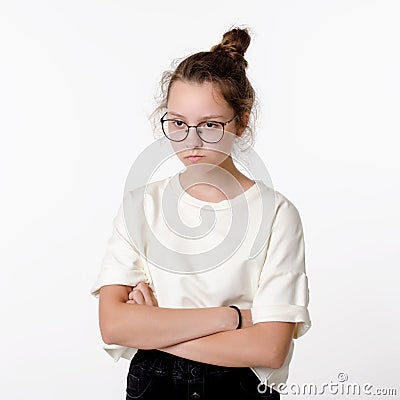 Cute Ñaucasian teen girl with glasses frown and take offense, portrait on white background Stock Photo