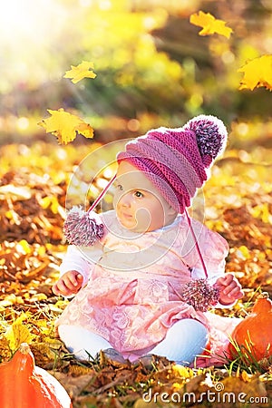 Cute autumn baby girl in golden soft light Stock Photo