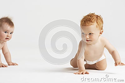 Cute Babies Crawling Stock Photo