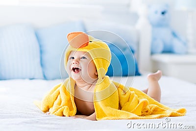 Cute baby after bath in yellow duck towel Stock Photo