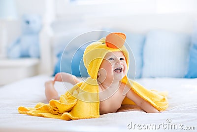 Cute baby after bath in yellow duck towel Stock Photo