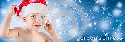 Cute baby boy with christmas cap in abstract snowy panoramic ba Stock Photo