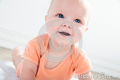 Cute baby girl with big eyes looking up, close up Stock Photo
