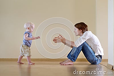 Cute baby girl learning to walk Stock Photo