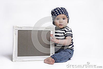 Cute baby holding a blank framed sign Stock Photo