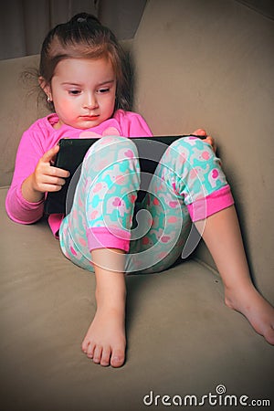 Cute Baby on iPad Stock Photo