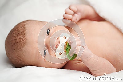 Cute baby with nipple portrait Stock Photo