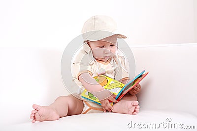 Cute baby reading Stock Photo