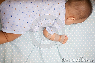 Cute Baby Sleeping laying prone Stock Photo