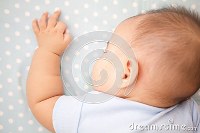 Cute Baby Sleeping laying prone Stock Photo