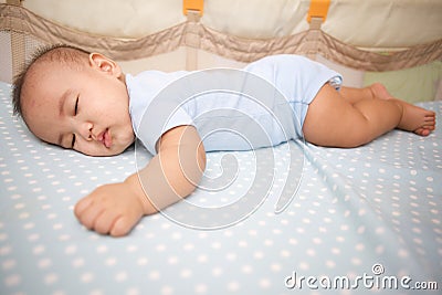 Cute Baby Sleeping laying prone Stock Photo