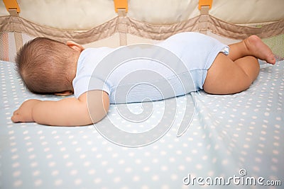 Cute Baby Sleeping laying prone Stock Photo