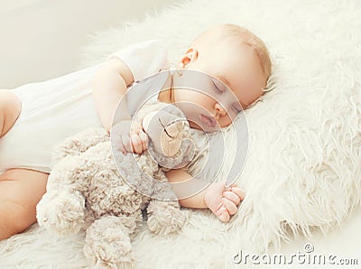 Cute baby sleeping on soft bed home Stock Photo