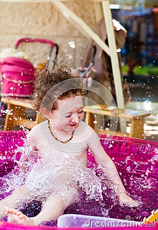 Cute baby splashing water Stock Photo