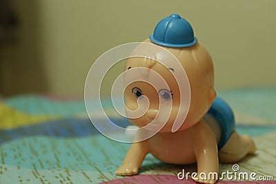 Cute Baby Toy in crwaling pose Stock Photo