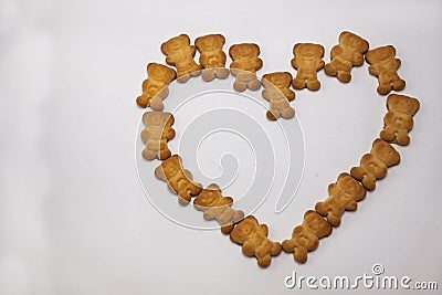 Cute bears cookies heart shaped pattern isolated on white background. View from above, flat lay, copy space. Stock Photo