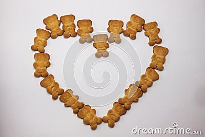 Cute bears cookies heart shaped pattern isolated on white background. View from above, flat lay, copy space. Stock Photo