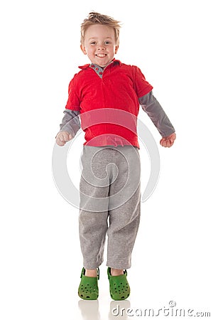 Cute blond boy jumping Stock Photo