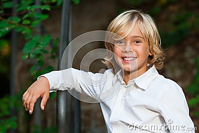 Cute blond boy outdoors. Stock Photo