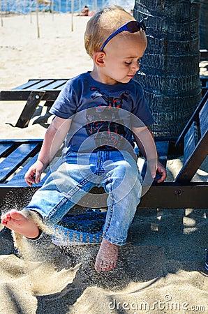 Cute blond child at the beach Stock Photo