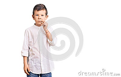 Cute blond kid wearing elegant shirt mouth and lips shut as zip with fingers Stock Photo