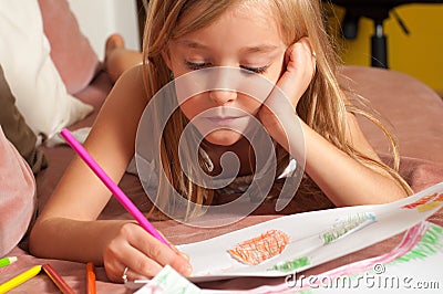 Cute blond little girl drawing on the paper Stock Photo