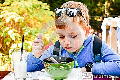 Child eating a soup Stock Photo