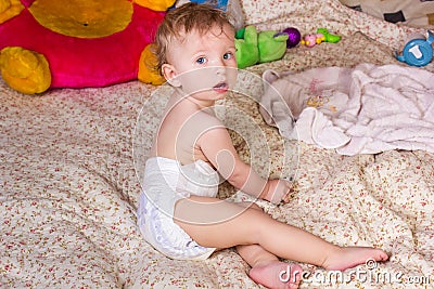 Cute blonde baby girl with beautiful blue eyes Stock Photo