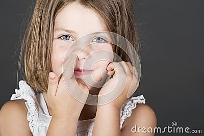 Cute Blonde Child Picking her Nose Stock Photo