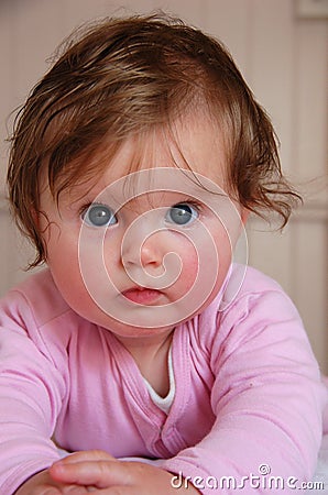 Cute blue eyed baby girl Stock Photo