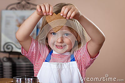 Cute boy baking ginger bread cookies Stock Photo