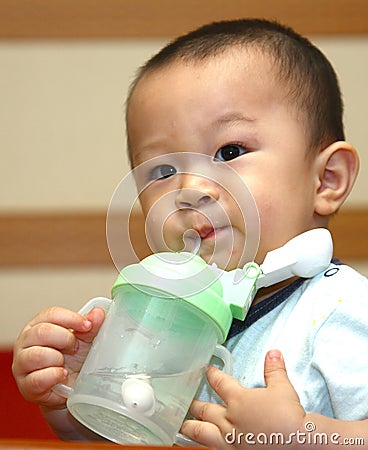 Cute boy drinking Stock Photo