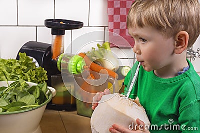 Cute boy drinking coconut water Stock Photo