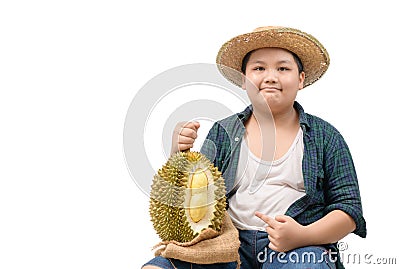 Cute boy farmer hold durian and a finger pointed to the durian. isolated Stock Photo