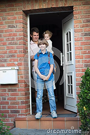 Cute boy leaving home for his first day back to school Stock Photo
