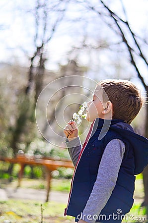 Cute boy outdoor at a spring time Stock Photo