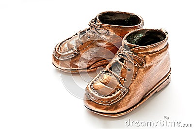 Cute bronze babyshoes Stock Photo