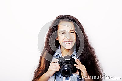 Cute brunette little girl holding an photo camera Stock Photo