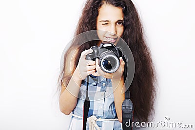 Cute brunette little girl holding an photo camera Stock Photo