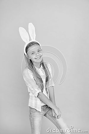 Cute bunny. Holiday bunny girl posing with cute long ears. Child smiling play bunny role. Happy childhood. Traditions Stock Photo