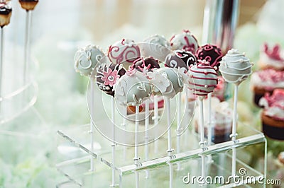 Cute candy bar with various candies and cakes. Wedding candybar Stock Photo