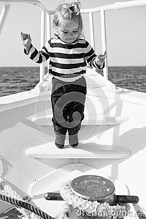 Cute and carefree. Adventure boy sailor travelling sea. Child cute sailor on yacht sunny day. Boy adorable sailor Stock Photo