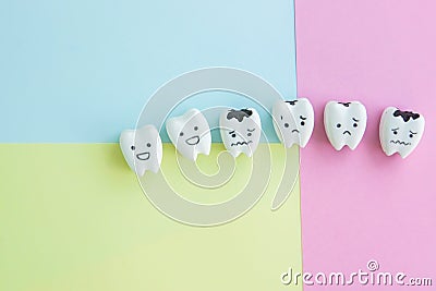 Cute cartoon healthy and decayed teeth icon on pastel backdrop Stock Photo