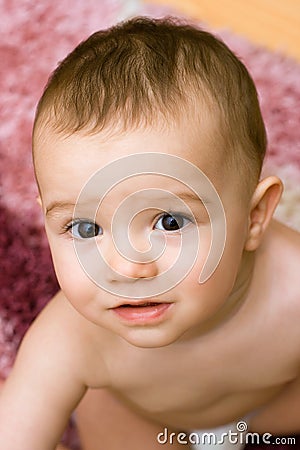 Cute caucasian baby on the carpet Stock Photo