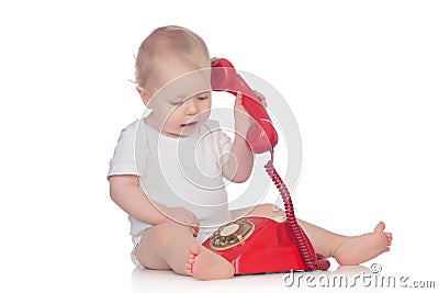 Cute caucasian baby playing with telephone Stock Photo