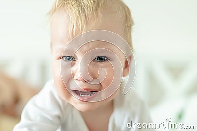 Cute caucasian blond toddler boy portrait crying at home during hysterics. Little child feeling sad. Little actor acting sadness Stock Photo