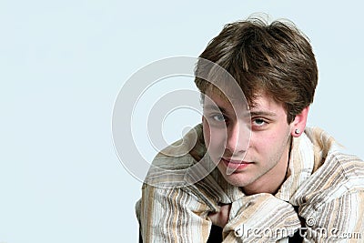 Cute caucasian teen boy with earring Stock Photo