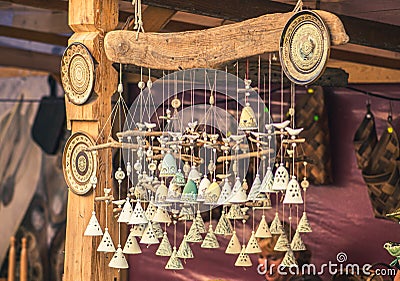 Cute ceramic traditional bells in a folk arts and crafts fair or market Stock Photo