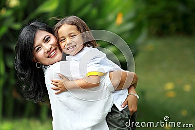 Cute cheerful child with mother Stock Photo