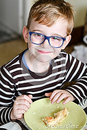 Cute child at breakfast Stock Photo